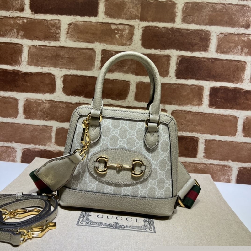 G*u*i top handle bags